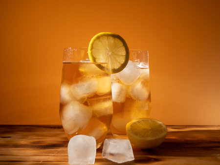 Iced tea in a glass with ice cubes. Cold tea with ice. close upの写真素材