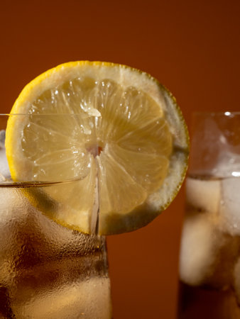 Iced tea in a glass with ice cubes. Cold tea with ice. close upの写真素材
