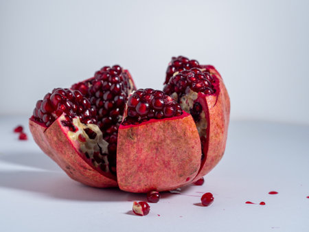 Ripe pomegranate. Fresh juicy pomegranate on a light background. Close up.の写真素材