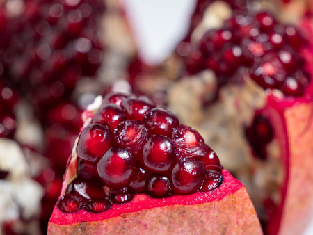 Ripe pomegranate. Fresh juicy pomegranate on a light background. Close up.の写真素材