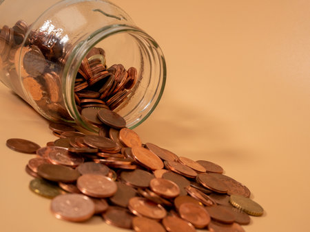 Glass jar with coins. Piggy bank with euro cents. Close up.