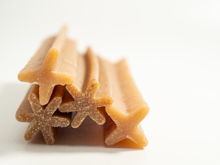 Dog teeth cleaning sticks. Puppy toothpick to reduce tartar formation on a white background. Close up.の写真素材