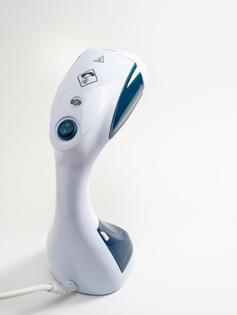 Steamer for clothes on a white background. Portable iron. Iron for ironing clothes.の写真素材