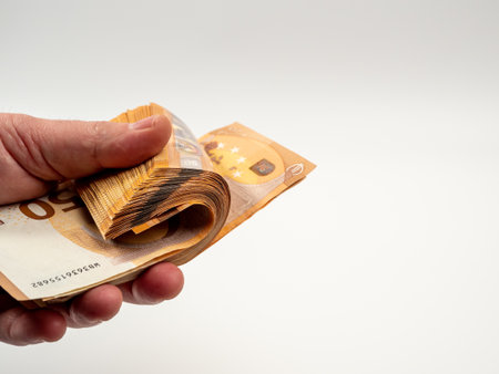 In the hands of 50 euro bills on a white background. Money on a white background. close up.