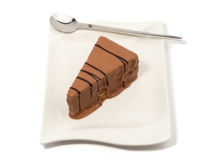 Piece of chocolate cake isolated on white background. A slice of chocolate cake.の写真素材