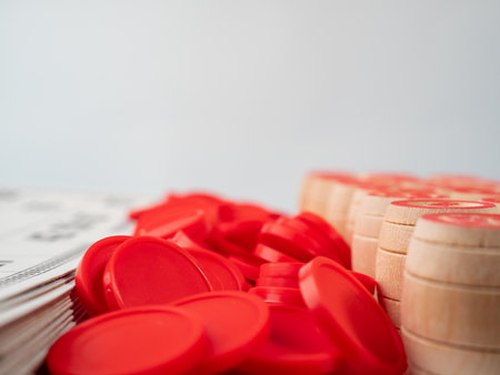 Board game bingo. Wooden barrels with lotto numbers, playing cards for the game. Close up.の写真素材