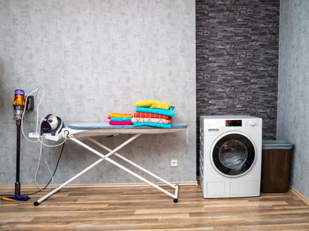 Laundry room interior with washing machine against the wall. Modern washing machine.の写真素材