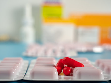 Red medical capsules. Capsules in a blister pack. Close up.の写真素材