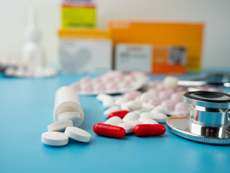 Medicines and a stethoscope. Capsules and tablets. Close up.の写真素材
