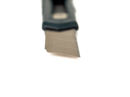 Box cutter on a white background. Stationery knife set. close up.