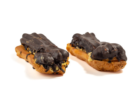 Delicious chocolate eclairs isolated on white background. Eclairs close-up.