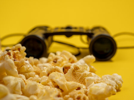 Popcorn on a yellow background. Sweet popcorn on yellow. Close up.の写真素材