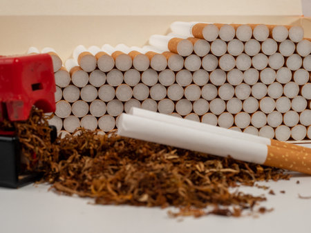 Tobacco and filling machine. Cigarettes and tobacco. Tobacco close up.の写真素材
