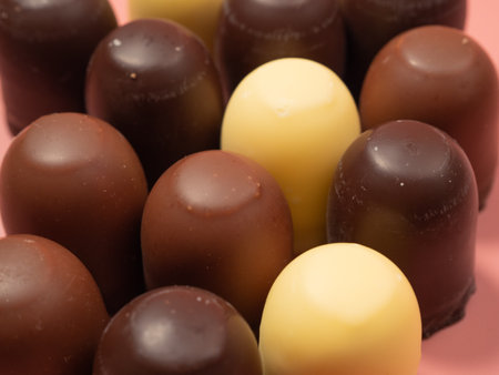 Chocolate covered marshmallow on a pink background. Close up.の写真素材