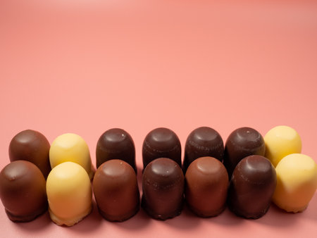 Chocolate covered marshmallow on a pink background. Close up.の写真素材