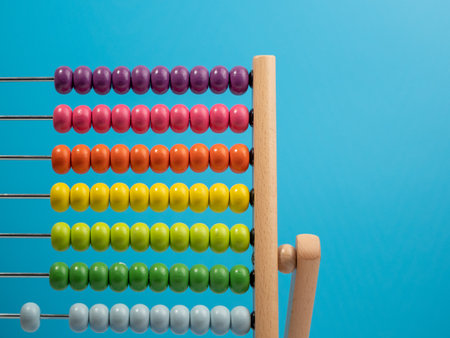 Wooden abacus on a blue background, Wooden abacus for children. Wooden abacus close up.の写真素材