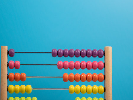 Wooden abacus on a blue background, Wooden abacus for children. Wooden abacus close up.の写真素材