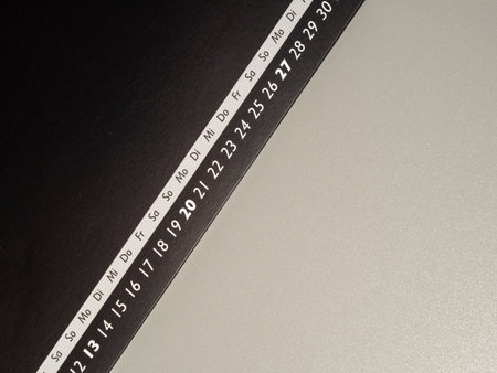 Close-up of retro clock and calendar with push pins. Time concept.