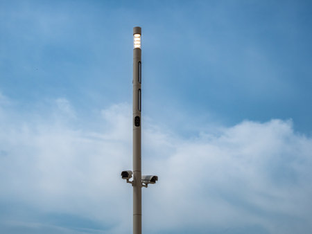 Surveillance cameras on a pole against the sky. Surveillance cameras for the object.の写真素材