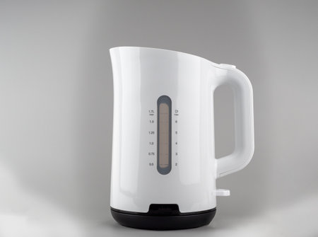 Modern white plastic electric kettle. Kettle close up.の写真素材