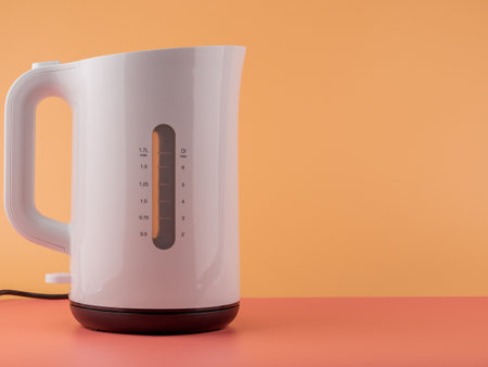 Modern white plastic electric kettle. Kettle close up.の写真素材
