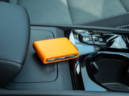 Car ignition key on the armrest in the interior of a modern car. Forgot my keys in the car.の写真素材