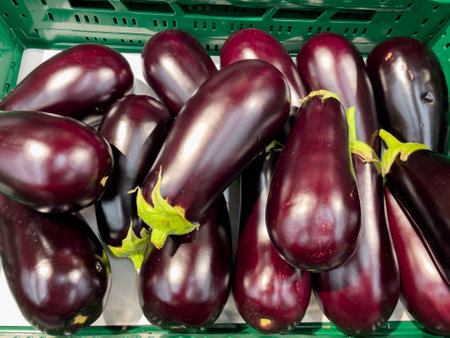 Egg plants on the shelves in the supermarket. Egg plant close up.の写真素材