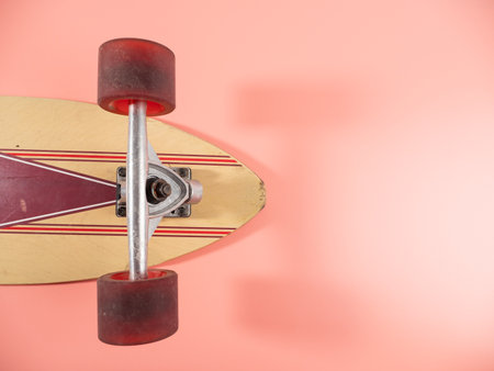 Skateboard on a pink background. Skateboard close up.の写真素材