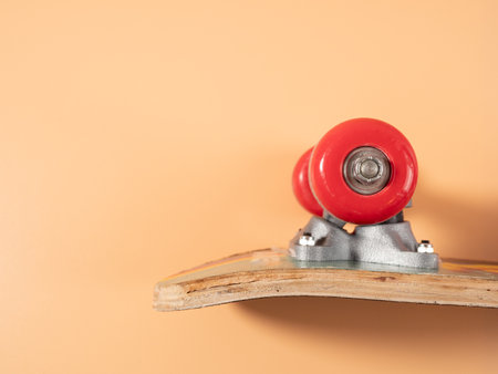 Skateboard on an orange background. Skateboard close up.の写真素材