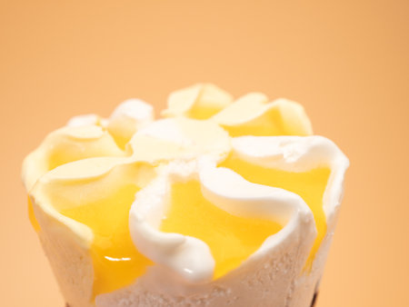 Lemon ice cream waffle cups. Ice cream on an orange background.