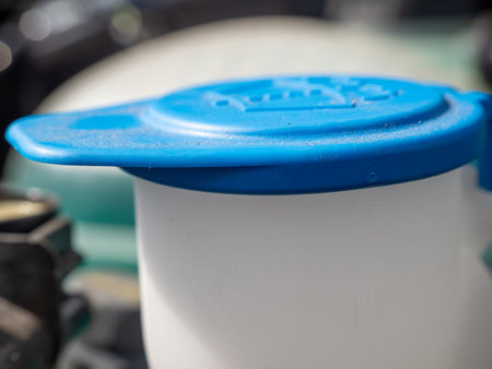 Reservoir of the windshield washer system of the car. Close-up of a tank for liquid for washing glasses.の写真素材