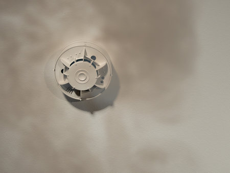 The smoke detector is installed on the ceiling and smoke rises underneath it. Fire alarm sensor.の写真素材