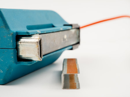 Electric forklift on a white background. Electric staple gun close-up.の写真素材