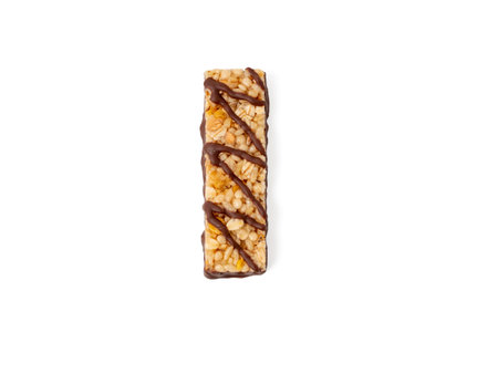 Muesli bars isolated on white background. Healthy vegan desserts. Cereal bar with nuts, chocolate and berries.の写真素材