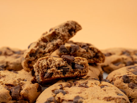Oatmeal cookies with chocolate chips on an orange background. Classic oatmeal cookies with...