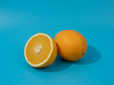 Ripe oranges on a blue background. Oranges on blue.の写真素材