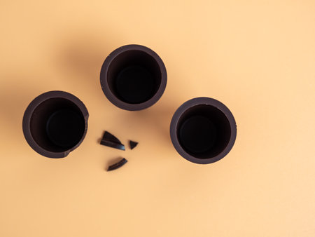 A glass of chocolate on an orange background. Chocolate cup close upの写真素材