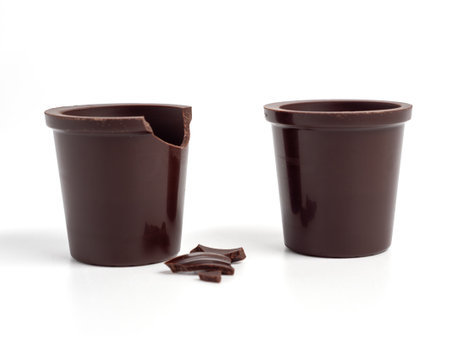 A glass of chocolate on a white background. Chocolate cup close upの写真素材