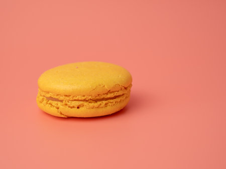 Colorful French macaroons on a pink background. French macaroons close-up.の写真素材