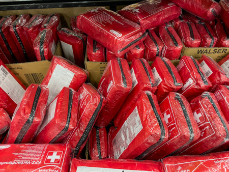 Berlin, Germany, May 10, 2024 A stack of red Walser first aid kits. The kits are in plastic and are stacked on top of each otherのeditorial素材
