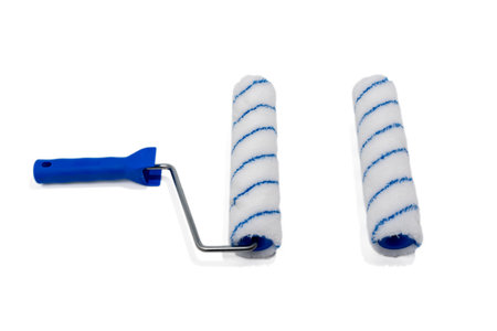 Roller for painting walls on white. Painter's tool isolated on white background.の写真素材