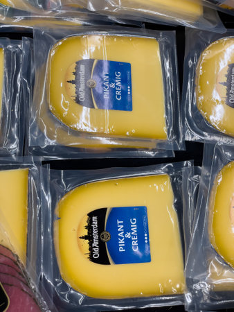 Germany Berlin May 25, 2024 A row of plastic wrapped cheese blocks with the word on themのeditorial素材