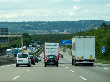 Germany May 17, 2024 A busy highway with a large truck in the middle of the road. The truck is driving along the middle lane.のeditorial素材