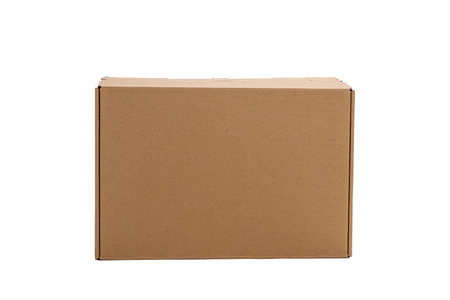 A cardboard box is sitting on a white background. The box is brown and has a rectangular shape