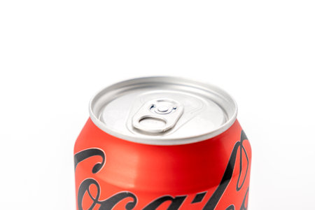 Coca-Cola can with lid. The jar is red and silver.
