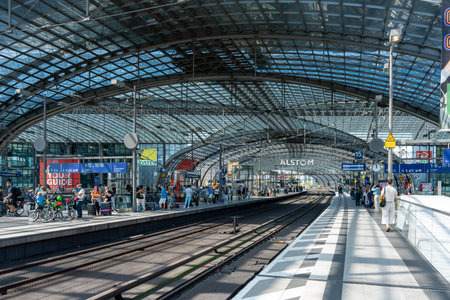 Germany Berlin August 7, 2024. The platforms of Berlin's main railway station are full of passengers. The glass main railway station.のeditorial素材