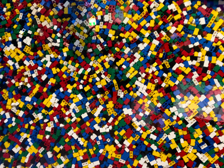 A pile of colorful legos with a variety of colors and sizes. Concept of creativity and playfulness,...