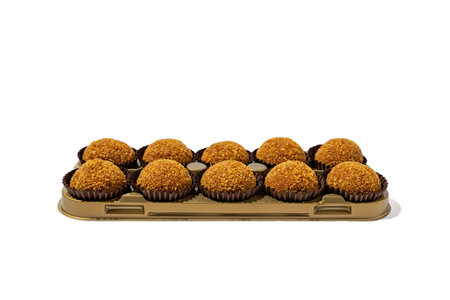 In packaging honey balls isolated on white background. Honey balls in paper wrapper.の写真素材