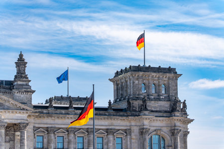 The Reichstag building with the German and EU flags flying. Flags flying on the Reichstag building.の写真素材