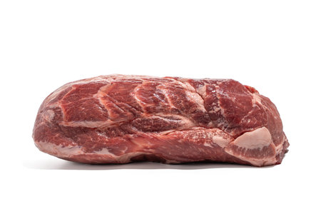 Unpacked pork neck side. Raw pork without packaging on a white background. The strong grain shows the high fat content for intense flavor.の写真素材